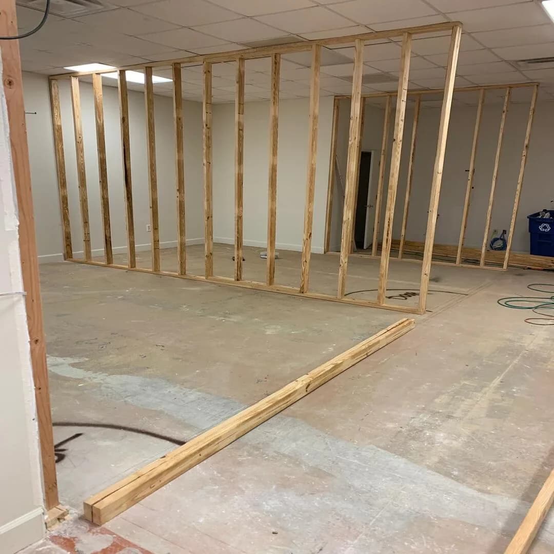 Interior wood stud framing for a new layout by JC General Painting in South Florida