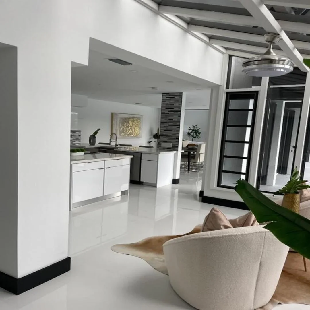 Modern open-concept living and kitchen by JC General Painting in South Florida